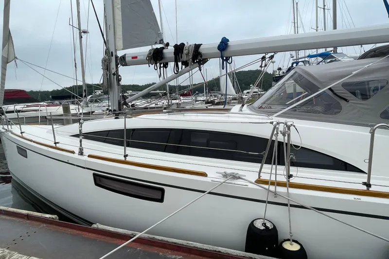 Slide: The Image of Sailboat Bavaria Vision 42, 2013 model, docked at marina with overcast sky. - 10