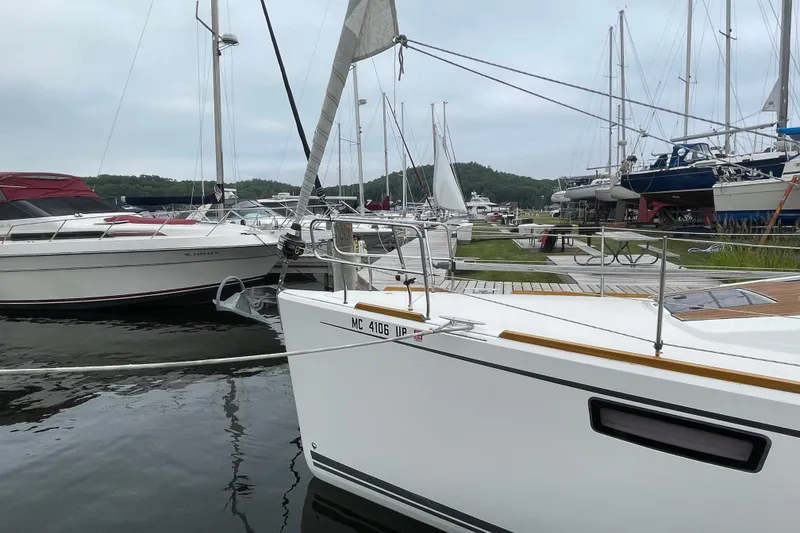 Slide: The Image of Sailboats docked at a marina, featuring a 2013 Bavaria Vision 42. - 13