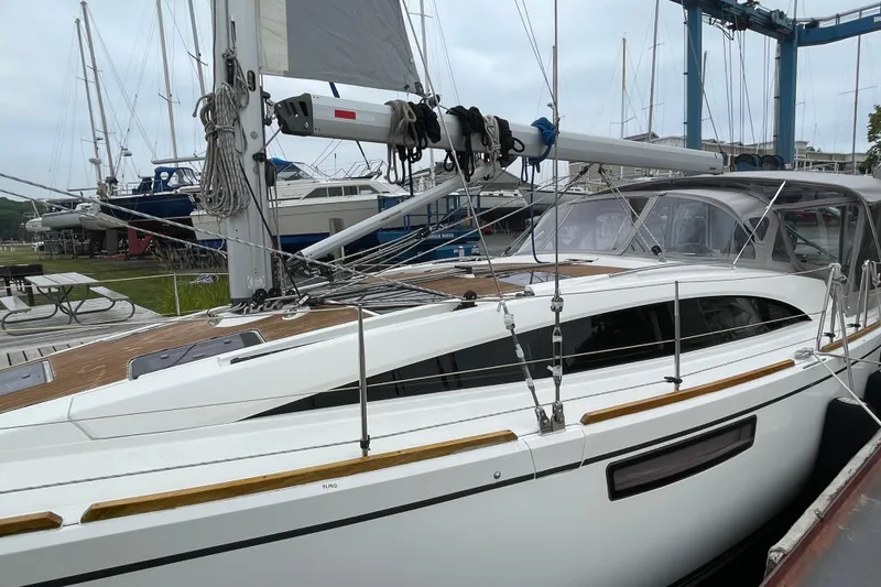 Slide: The Image of 2013 Bavaria Vision 42 sailboat docked, showcasing sleek design and modern rigging. - 15