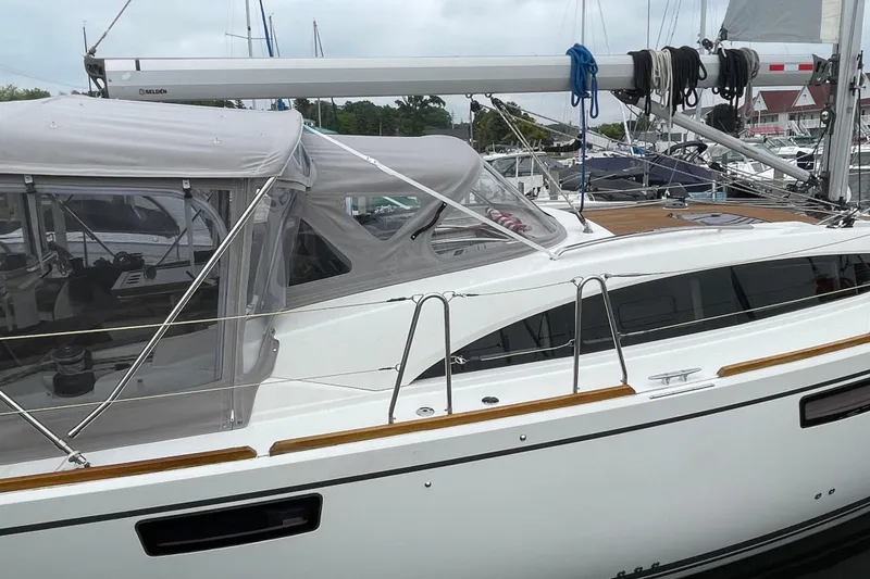 Slide: The Image of 2013 Bavaria Vision 42 sailboat docked, featuring sleek design and modern canopy. - 19