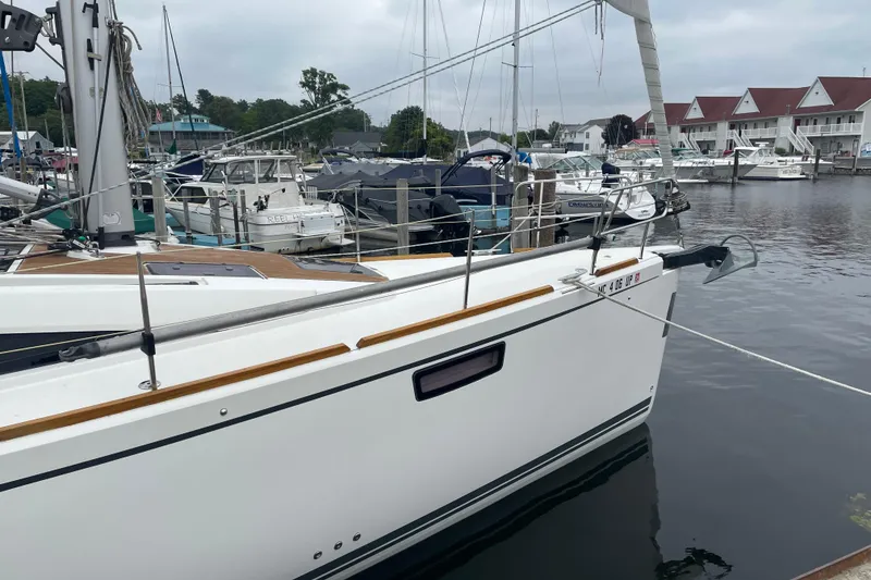 Slide: The Image of Sailboat Bavaria Vision 42, 2013 model, docked in a marina with other boats. - 21