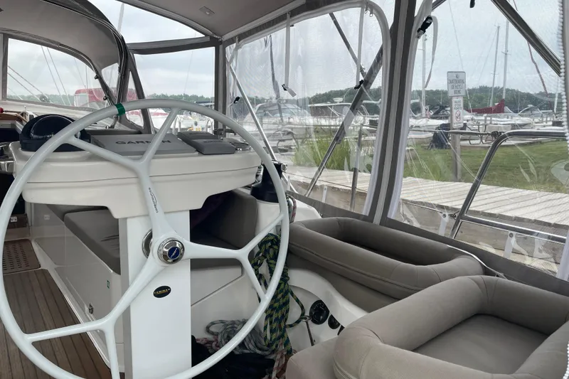 Slide: The Image of Interior view of 2013 Bavaria Vision 42 yacht with steering wheel and seating area. - 26