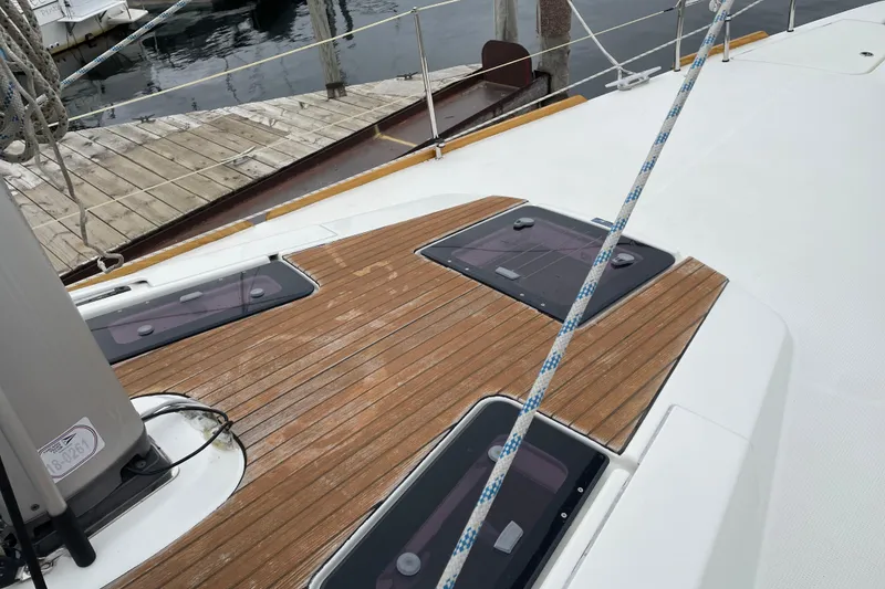 Slide: The Image of Deck of 2013 Bavaria Vision 42 sailboat with wooden finish and docked at marina. - 39