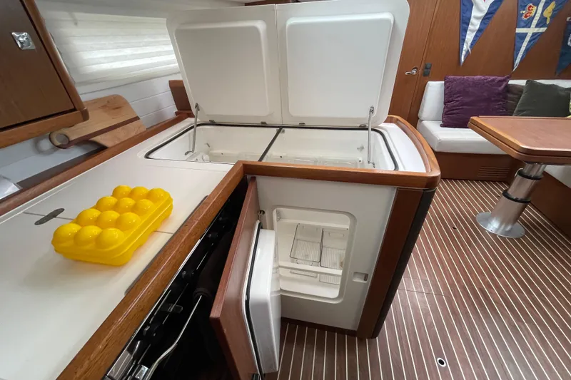 Slide: The Image of Interior of 2013 Bavaria Vision 42 yacht kitchen with open fridge and egg holder. - 49