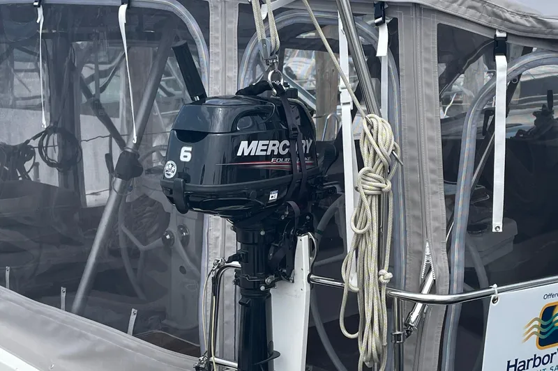 Slide: The Image of Mercury outboard motor on 2013 Bavaria Vision 42 sailboat, docked with protective canopy. - 5