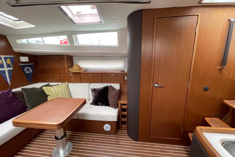 Slide: The Image of Interior of 2013 Bavaria Vision 42 yacht with cozy seating and wooden finishes. - 52