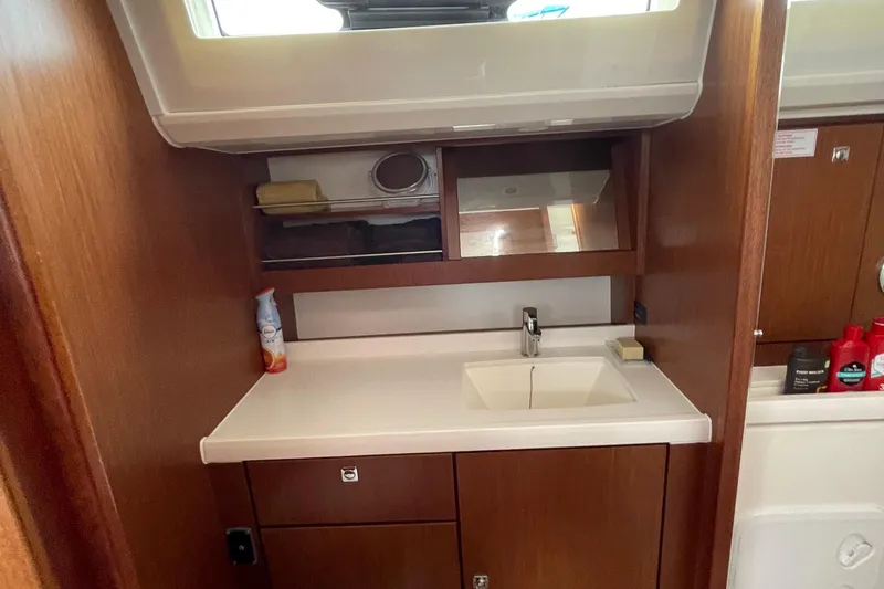 Slide: The Image of Interior of 2013 Bavaria Vision 42 yacht bathroom with sink and wooden cabinetry. - 56