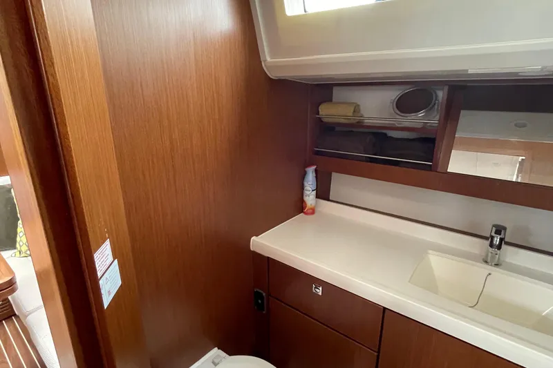 Slide: The Image of Interior of 2013 Bavaria Vision 42 yacht bathroom with wooden cabinetry and sink. - 57
