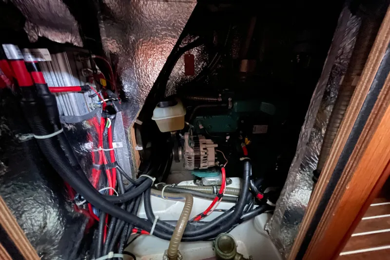 Slide: The Image of Engine compartment of a 2013 Bavaria Vision 42 sailboat with visible wiring and components. - 60