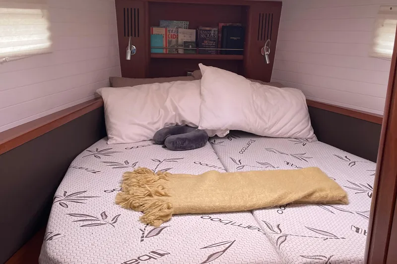 Slide: The Image of Cozy cabin bedroom in 2013 Bavaria Vision 42 yacht with books and pillows. - 63