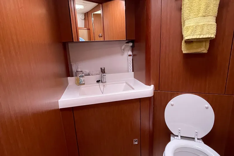 Slide: The Image of Luxurious bathroom in 2013 Bavaria Vision 42 yacht with wooden cabinetry and modern fixtures. - 66