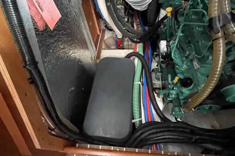 Slide: The Image of Engine compartment of a 2013 Bavaria Vision 42 sailboat with visible wiring and components. - 70