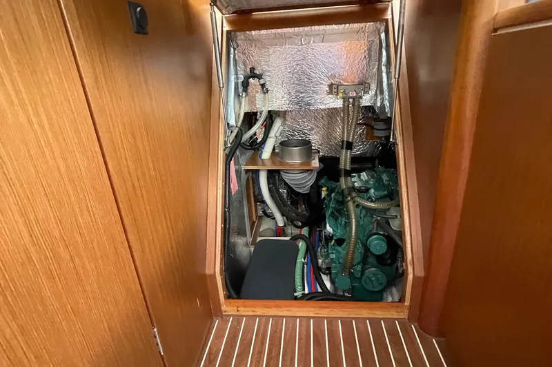 Slide: The Image of Engine compartment of 2013 Bavaria Vision 42 sailboat, featuring mechanical components and insulation. - 73