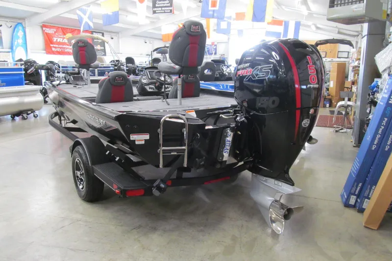 Slide: The Image of 2026 Ranger RT198P boat with Mercury Pro XS 150 engine in showroom. - 3