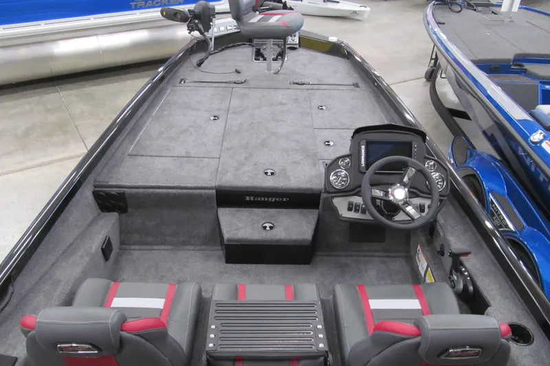 Slide: The Image of 2026 Ranger RT198P boat interior with steering console and seating. - 5