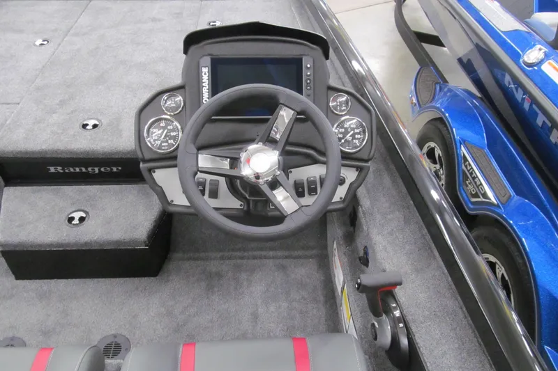Slide: The Image of 2026 Ranger RT198P boat dashboard with steering wheel and control panel. - 6