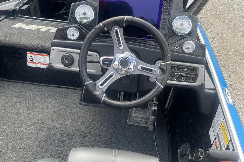 Slide: The Image of Steering console of a 2021 Nitro Z20 boat with gauges and controls. - 11
