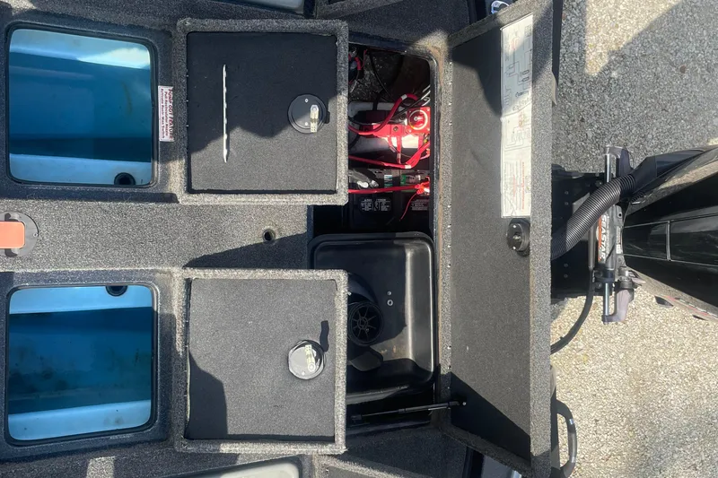 Slide: The Image of 2021 Nitro Z20 boat storage compartments and battery area, showcasing organized layout. - 12