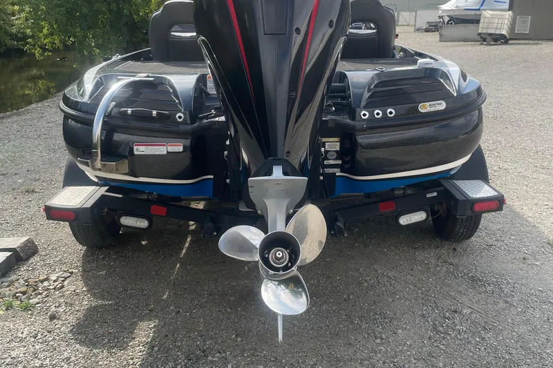 Slide: The Image of 2021 Nitro Z20 boat rear view with motor and propeller on gravel. - 15