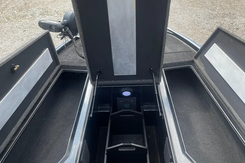 Slide: The Image of 2021 Nitro Z20 boat storage compartments with open lids, showcasing interior space. - 9