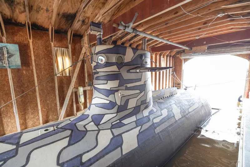 Slide: The Image of Camouflaged 2023 Submarine 28 Composite Construction in wooden boathouse. - 9