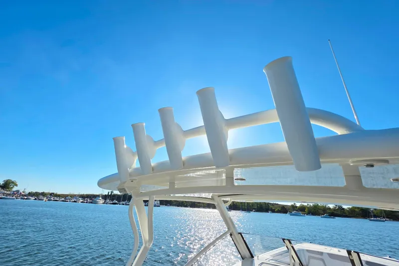 Slide: The Image of 2018 World Cat 280 DC-X boat with rod holders, sunny day on the water. - 10