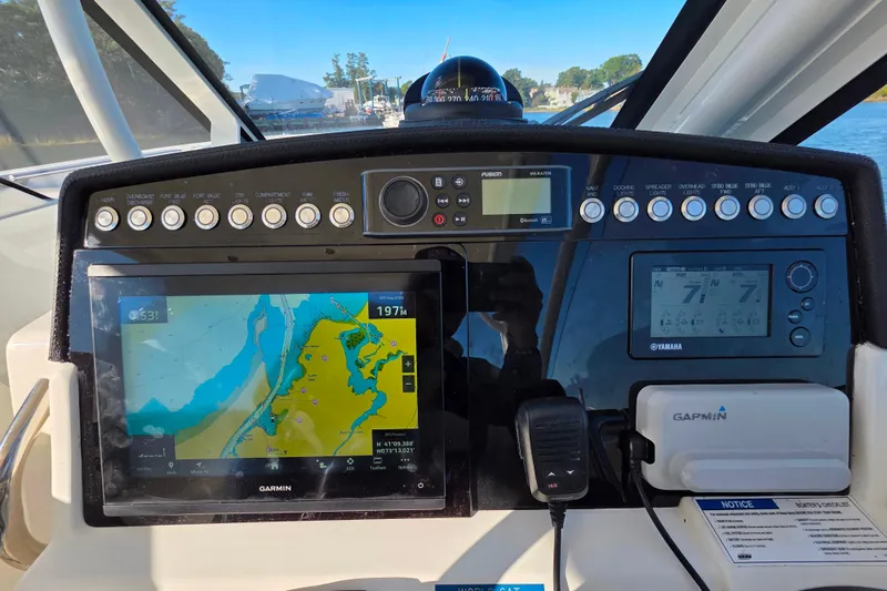 Slide: The Image of Dashboard of 2018 World Cat 280 DC-X with navigation and control systems. - 11