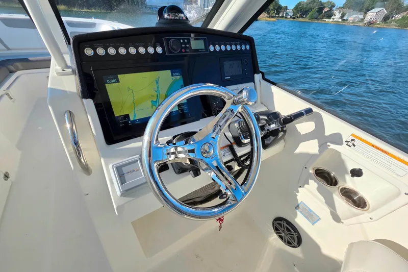 Slide: The Image of Helm of 2018 World Cat 280 DC-X with navigation display and steering wheel. - 13