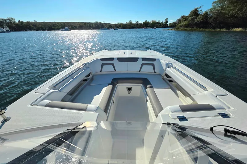 Slide: The Image of 2018 World Cat 280 DC-X boat on serene water, featuring spacious seating and clear skies. - 29