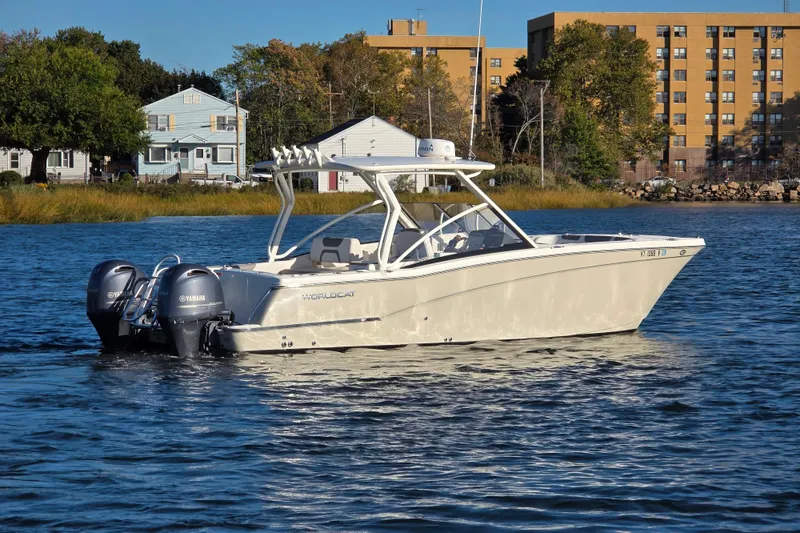 Slide: The Image of 2018 World Cat 280 DC-X boat on calm water with Yamaha engines. - 3