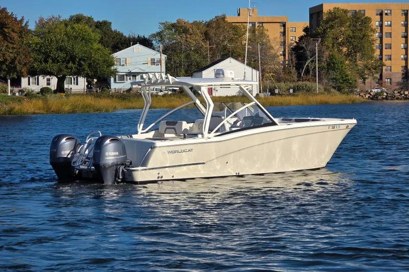 Slide: The Image of 2018 World Cat 280 DC-X boat on water with twin Yamaha engines. - 4