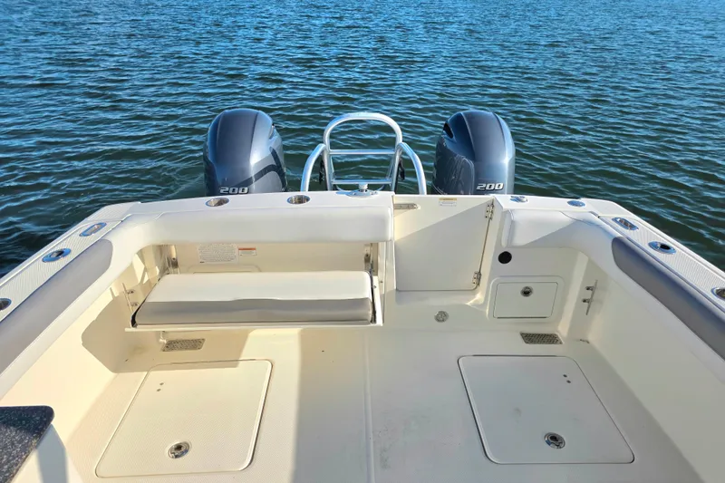 Slide: The Image of 2018 World Cat 280 DC-X boat deck with twin 200 engines on water. - 9