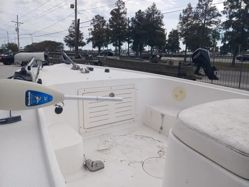 Slide: The Image of Mako 171 boat interior, 2001 model, featuring a clean white deck and storage compartment. - 4