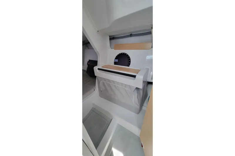 Slide: The Image of Interior of 2020 Dehler 30 OD sailboat, featuring compact storage and modern design. - 19