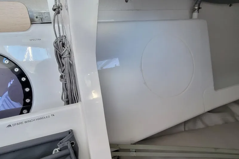 Slide: The Image of Interior of 2020 Dehler 30 OD sailboat, featuring storage and winch handles. - 21