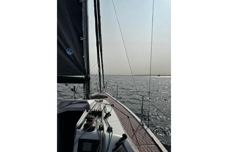Slide: The Image of 2020 Dehler 30 OD sailboat on calm waters under a clear sky. - 4