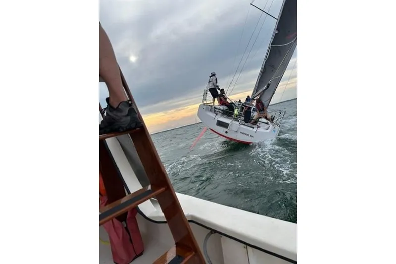Slide: The Image of Sailing Dehler 30 OD yacht on open water, 2020 model, with crew in action. - 5