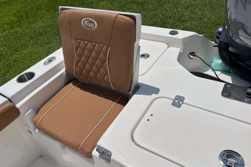 Slide: The Image of 2026 Key West 210 Bay Reef boat seat with tan upholstery and diamond stitching. - 12
