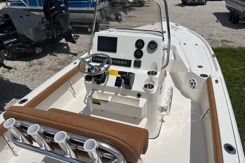 Slide: The Image of 2026 Key West 210 Bay Reef boat interior with modern console and seating. - 7