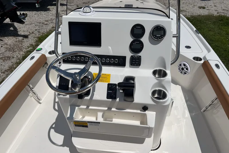 Slide: The Image of 2026 Key West 210 Bay Reef boat console with steering wheel and control panel. - 8