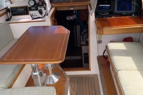 Slide: The Image of 1999 Little Harbor 51 Pilothouse kitchen with wooden cabinetry, stove, and sink. - 11