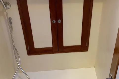 Slide: The Image of 1995 Little Harbor 51 Pilothouse yacht kitchen with wood cabinetry and modern appliances. - 17