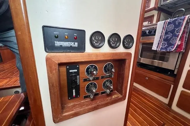 Slide: The Image of Interior of 1995 Little Harbor 51 Pilothouse with seating and navigation equipment. - 22