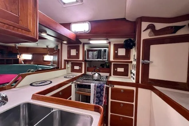 Slide: The Image of Sailboat with wind turbine on water, Little Harbor 51 Pilothouse, 1995 model. - 29