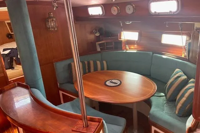 Slide: The Image of 1999 Little Harbor 51 Pilothouse sailboat anchored in a serene bay. - 3