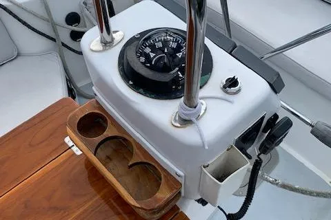 Slide: The Image of Interior of 1995 Little Harbor 51 Pilothouse with round table and teal seating. - 9