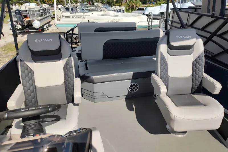 Slide: The Image of 2026 Sylvan L3 DLZ boat interior with modern seating and steering wheel. - 10