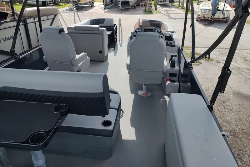 Slide: The Image of Interior of 2026 Sylvan L3 DLZ pontoon boat with seating and helm. - 17