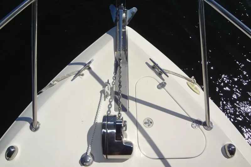 Slide: The Image of Bow of 2000 Monterey 302 Cruiser with anchor and ropes. - 11