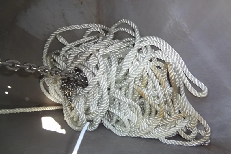 Slide: The Image of Tangled rope and chain in a 2000 Monterey 302 Cruiser boat compartment. - 12